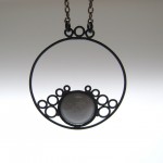 circle pendant in black with grey dome with black chain