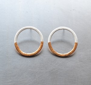 White circle earrings with gold leaf detail